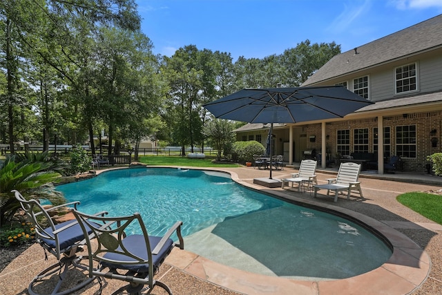 711 Valley Commons Dr, Huffman, TX 77336 - swimming pool featuring a patio area