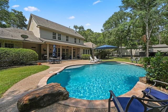 711 Valley Commons Dr, Huffman, TX 77336 - view of pool with a patio and a lawn