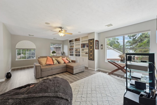 17150 Mountain Crest Dr, Spring, TX 77379 - living area featuring baseboards, wood finished floors, and ceiling fan