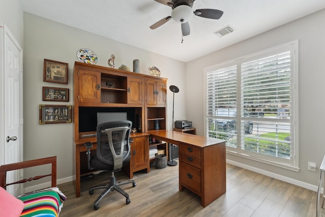 17150 Mountain Crest Dr, Spring, TX 77379 - office area with healthy amount of natural light, baseboards, a ceiling fan, and light wood-style flooring