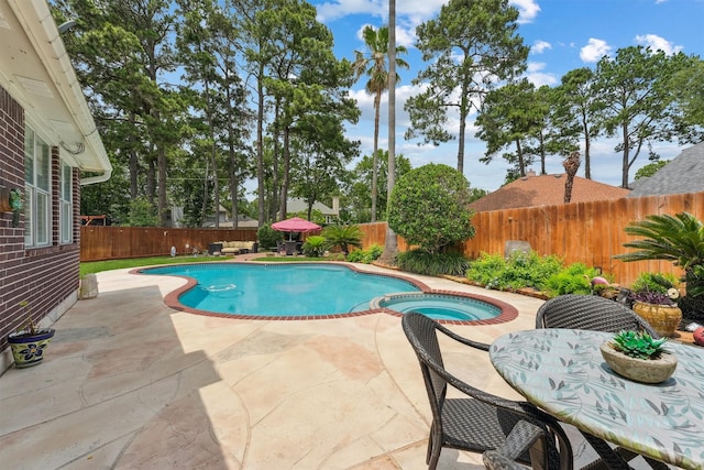 17150 Mountain Crest Dr, Spring, TX 77379 - view of swimming pool featuring a patio, a fenced backyard, and a pool with connected hot tub