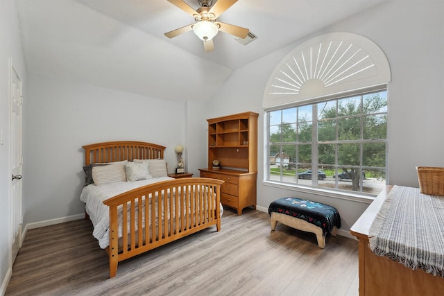 17150 Mountain Crest Dr, Spring, TX 77379 - bedroom with light wood finished floors, lofted ceiling, a ceiling fan, and baseboards