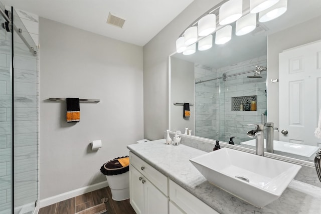 17150 Mountain Crest Dr, Spring, TX 77379 - bathroom with a stall shower, wood finished floors, baseboards, vanity, and toilet