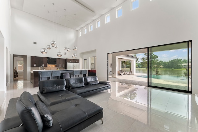 3214 W Benders Landing Blvd, Spring, TX 77386 - living room with a high ceiling and light tile patterned floors