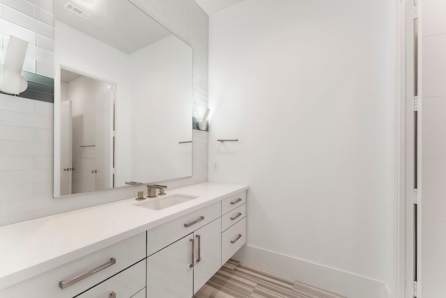 3214 W Benders Landing Blvd, Spring, TX 77386 - bathroom with vanity, baseboards, and wood finished floors