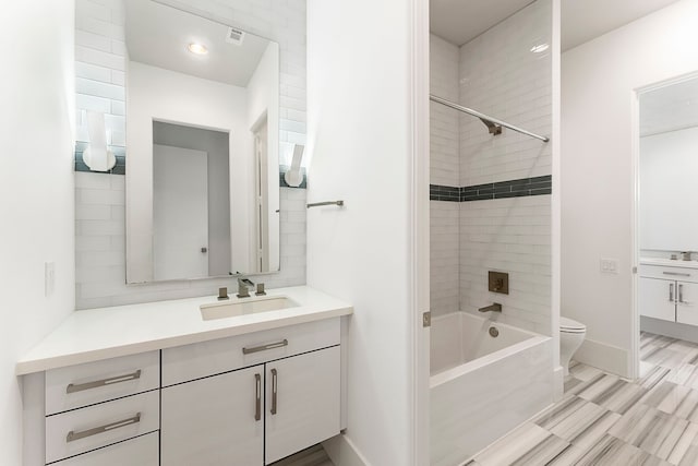 3214 W Benders Landing Blvd, Spring, TX 77386 - bathroom with vanity, toilet, shower / washtub combination, and baseboards