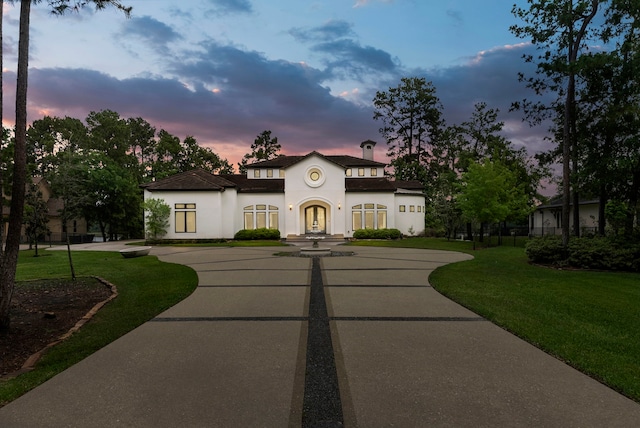 3214 W Benders Landing Blvd, Spring, TX 77386 - view of front of house featuring stucco siding, a front yard, and curved driveway