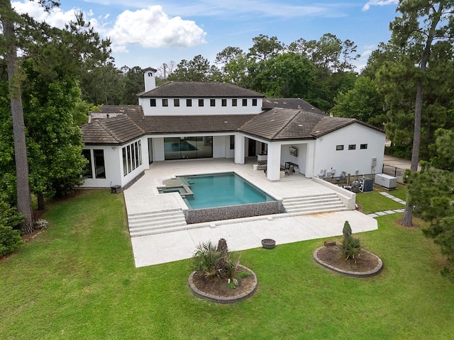 3214 W Benders Landing Blvd, Spring, TX 77386 - back of house featuring a patio, stucco siding, a chimney, and a yard