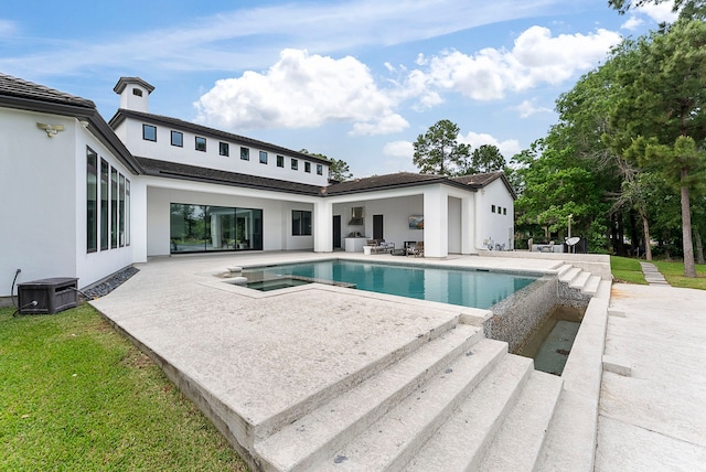 3214 W Benders Landing Blvd, Spring, TX 77386 - view of pool featuring a patio area, central AC unit, a lawn, and a pool with connected hot tub
