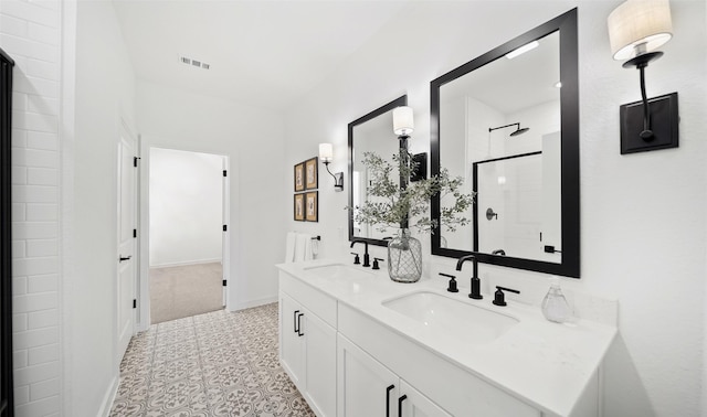 106 Kickapoo Dr, Anahuac, TX 77514 - full bath featuring double vanity and a shower with door