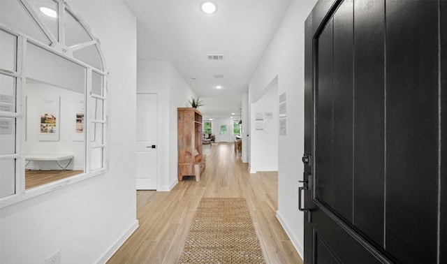 106 Kickapoo Dr, Anahuac, TX 77514 - corridor with light wood-style flooring and recessed lighting
