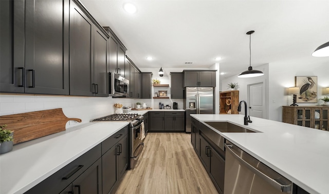 106 Kickapoo Dr, Anahuac, TX 77514 - kitchen featuring appliances with stainless steel finishes, a sink, open shelves, light countertops, and recessed lighting