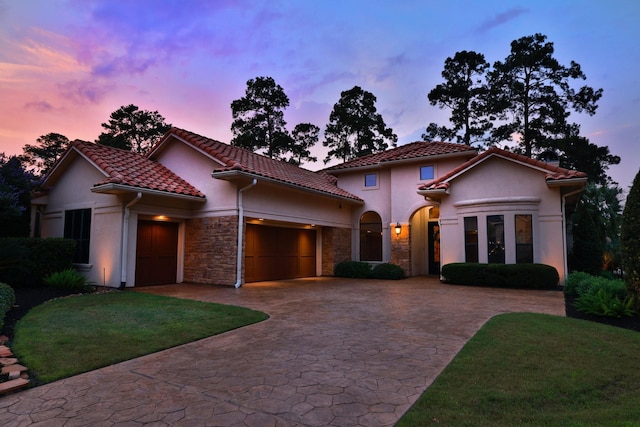 16114 Villa Fontana Way, Houston, TX 77068 - mediterranean / spanish-style home with a garage, stucco siding, decorative driveway, and stone siding