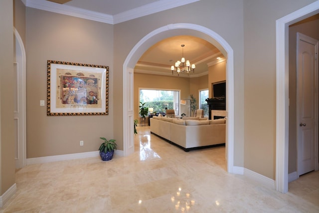 16114 Villa Fontana Way, Houston, TX 77068 - corridor with ornamental molding, a chandelier, arched walkways, a tray ceiling, and baseboards
