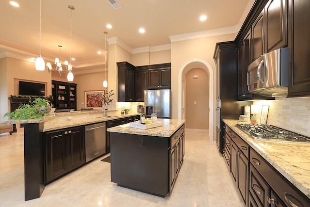 16114 Villa Fontana Way, Houston, TX 77068 - kitchen with stainless steel appliances, arched walkways, a sink, decorative backsplash, and a center island