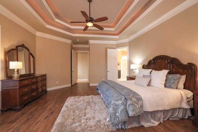 16114 Villa Fontana Way, Houston, TX 77068 - bedroom featuring a tray ceiling, dark wood finished floors, baseboards, a ceiling fan, and crown molding