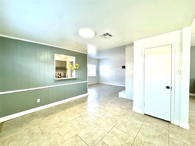 11127 Village Bend Ln Unit 1127, Houston, TX 77072 - spare room with baseboards, tile patterned flooring, and a brick fireplace