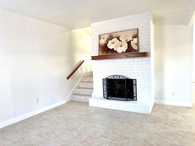 11127 Village Bend Ln Unit 1127, Houston, TX 77072 - unfurnished living room featuring a fireplace and stairs