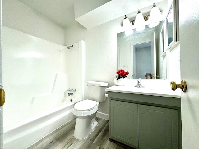 11127 Village Bend Ln Unit 1127, Houston, TX 77072 - full bathroom with wood finished floors, vanity, toilet, shower / washtub combination, and baseboards