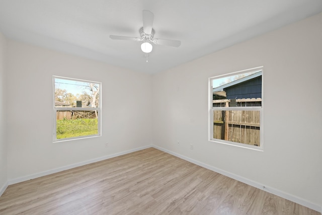 5763 Belneath St, Houston, TX 77033 - empty room with plenty of natural light, wood finished floors, and a ceiling fan