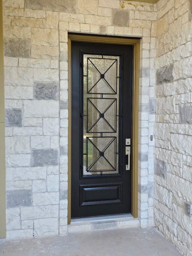 170 Nuuanu Ln, Bastrop, TX 78602 - view of exterior entry featuring stone siding