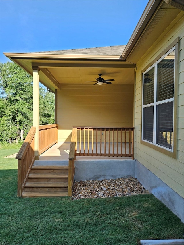 170 Nuuanu Ln, Bastrop, TX 78602 - wooden deck with a ceiling fan, a yard, and covered porch