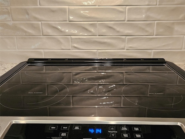 170 Nuuanu Ln, Bastrop, TX 78602 - kitchen view of decorative backsplash and electric stove