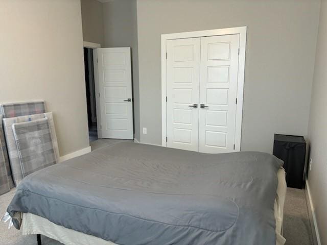 170 Nuuanu Ln, Bastrop, TX 78602 - bedroom featuring carpet floors, a closet, and baseboards