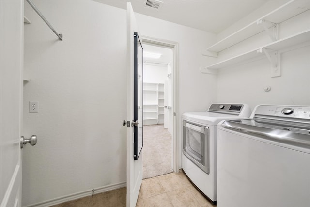 27506 Colin Springs Ln, Spring, TX 77386 - clothes washing area with washer and dryer and light tile patterned floors