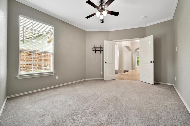 27506 Colin Springs Ln, Spring, TX 77386 - unfurnished bedroom featuring light colored carpet, multiple windows, ornamental molding, and baseboards