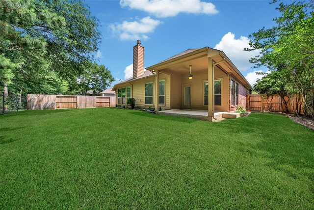 27506 Colin Springs Ln, Spring, TX 77386 - rear view of property with a chimney and a patio