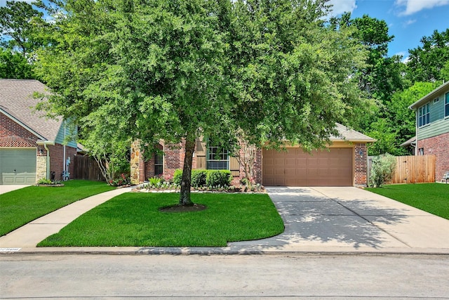 27506 Colin Springs Ln, Spring, TX 77386 - view of property hidden behind natural elements featuring brick siding, concrete driveway, and a garage