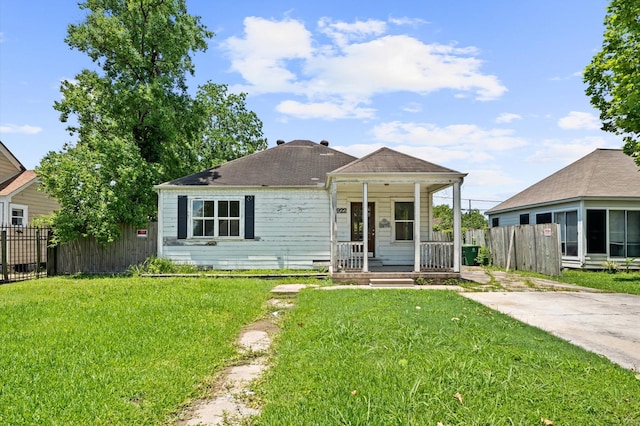 1922 Des Jardines St, Houston, TX 77023 - view of front of home featuring covered porch and roof with shingles