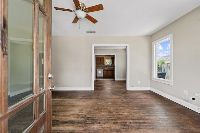 1922 Des Jardines St, Houston, TX 77023 - empty room featuring dark wood-type flooring, baseboards, and a ceiling fan