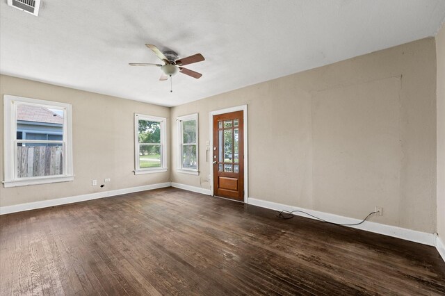 1922 Des Jardines St, Houston, TX 77023 - spare room featuring ceiling fan, dark wood finished floors, and baseboards
