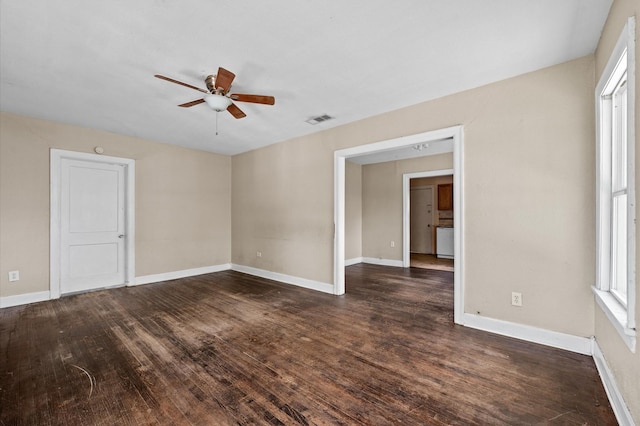 1922 Des Jardines St, Houston, TX 77023 - unfurnished room with a ceiling fan, dark wood-type flooring, healthy amount of natural light, and baseboards