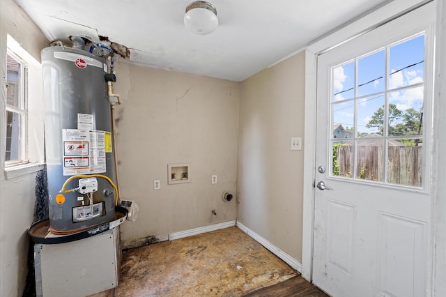 1922 Des Jardines St, Houston, TX 77023 - washroom featuring gas water heater, plenty of natural light, washer hookup, and baseboards