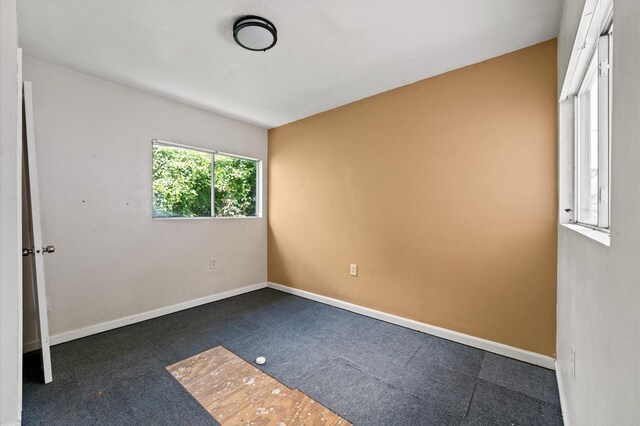 1922 Des Jardines St, Houston, TX 77023 - carpeted spare room with baseboards