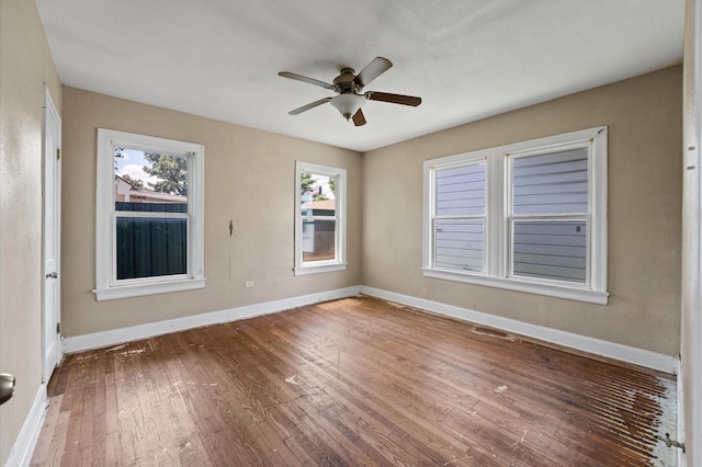 1922 Des Jardines St, Houston, TX 77023 - unfurnished room with hardwood / wood-style floors, a ceiling fan, and baseboards
