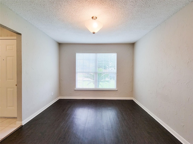 6722 Loch Bruceray Dr, Houston, TX 77084 - unfurnished room with a textured ceiling, wood finished floors, and baseboards