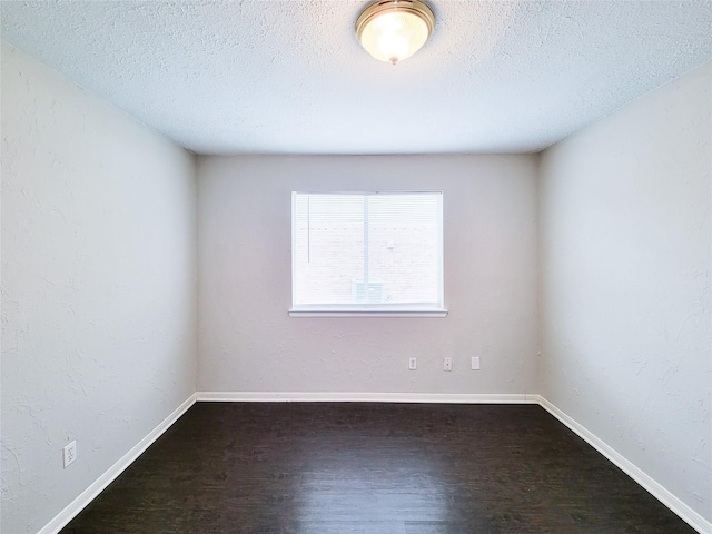 6722 Loch Bruceray Dr, Houston, TX 77084 - empty room with a textured ceiling, wood finished floors, and baseboards