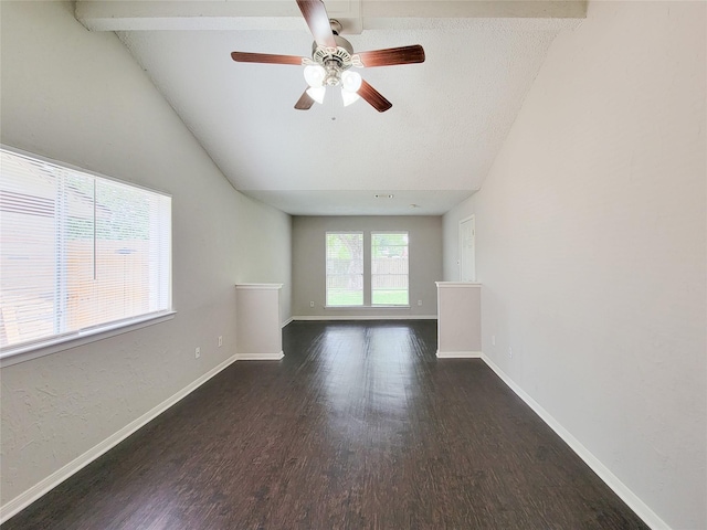 6722 Loch Bruceray Dr, Houston, TX 77084 - unfurnished living room with vaulted ceiling, wood finished floors, ceiling fan, and baseboards