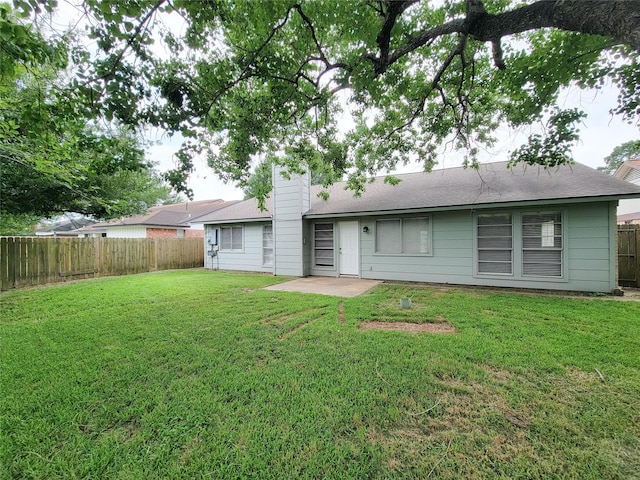 6722 Loch Bruceray Dr, Houston, TX 77084 - rear view of property featuring a chimney and roof with shingles