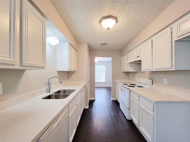 6722 Loch Bruceray Dr, Houston, TX 77084 - kitchen featuring white appliances, a sink, under cabinet range hood, a textured ceiling, and dark wood-type flooring