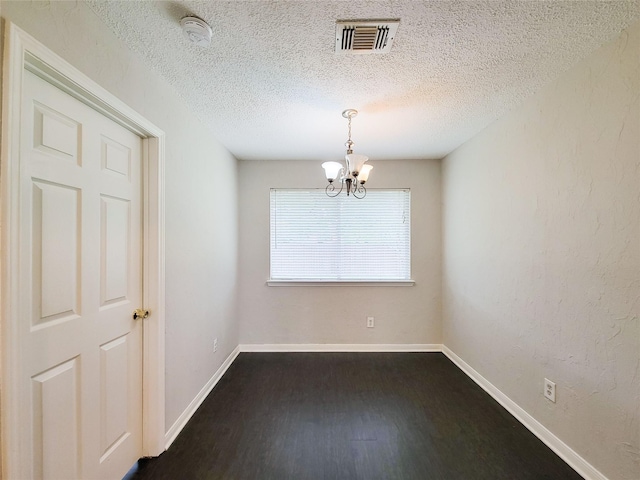 6722 Loch Bruceray Dr, Houston, TX 77084 - unfurnished room featuring a chandelier, a smoke detector, dark wood finished floors, a textured ceiling, and baseboards