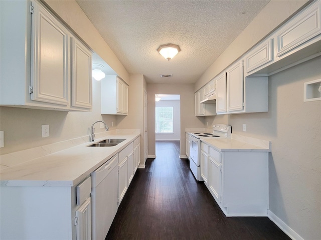 6722 Loch Bruceray Dr, Houston, TX 77084 - kitchen with a sink, white appliances, under cabinet range hood, a textured ceiling, and baseboards