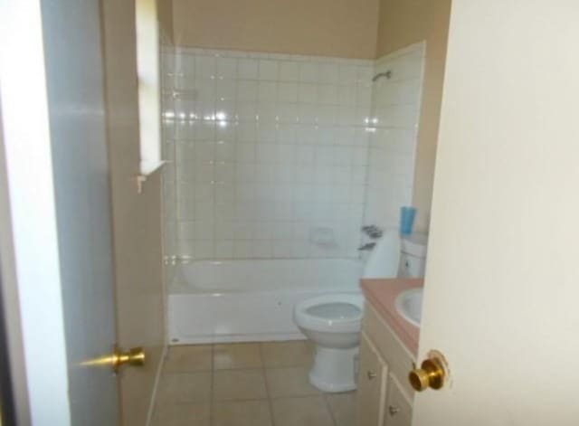 111 Sowescor St, Crockett, TX 75835 - bathroom with toilet, tile patterned floors, vanity, and shower / washtub combination