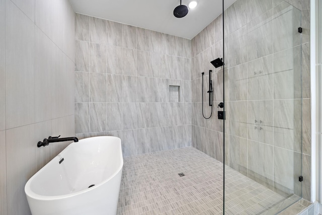 1706 Sedola Ln, Houston, TX 77055 - full bath with tiled shower, a freestanding tub, and tile walls
