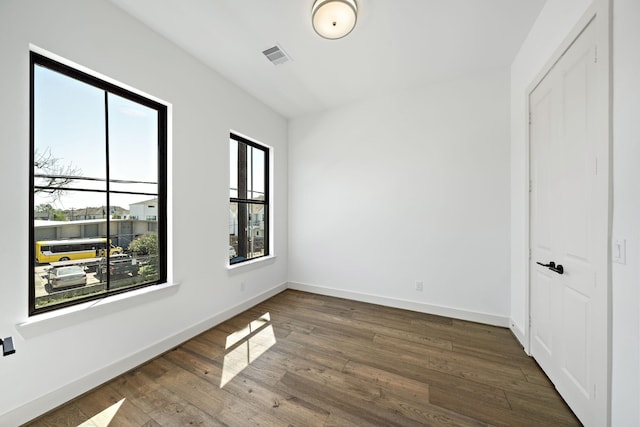 1706 Sedola Ln, Houston, TX 77055 - unfurnished bedroom with wood finished floors, baseboards, and a closet
