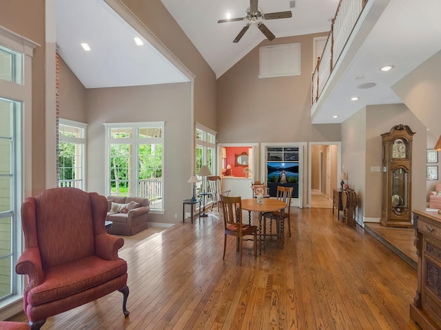 23222 Red Oak Trl, Tomball, TX 77377 - dining space featuring high vaulted ceiling, hardwood / wood-style flooring, plenty of natural light, a ceiling fan, and baseboards